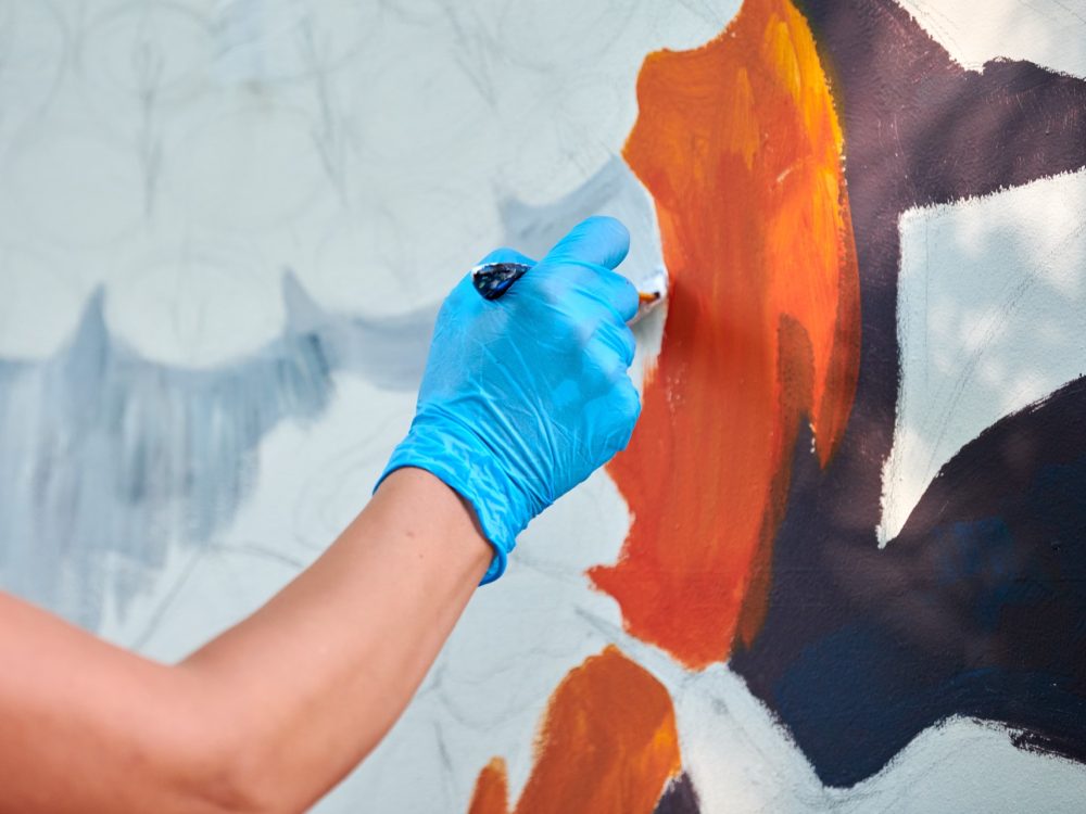woman-artist-hand-holds-paint-brush-and-draws-abst-2024-01-30-00-52-44-utc (1)